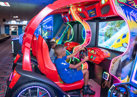 Kids enjoying arcade games at RollCall